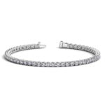 D28954051 1 Classic four prong 5 carat total weight diamond tennis bracelet showcasing perfectly matched brilliant round cut lab grown diamonds set in 14k white gold.
