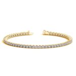 D78844572 1 Classic four prong 4 carat total weight diamond tennis bracelet showcasing perfectly matched brilliant round cut lab grown diamonds set in 14k yellow gold.